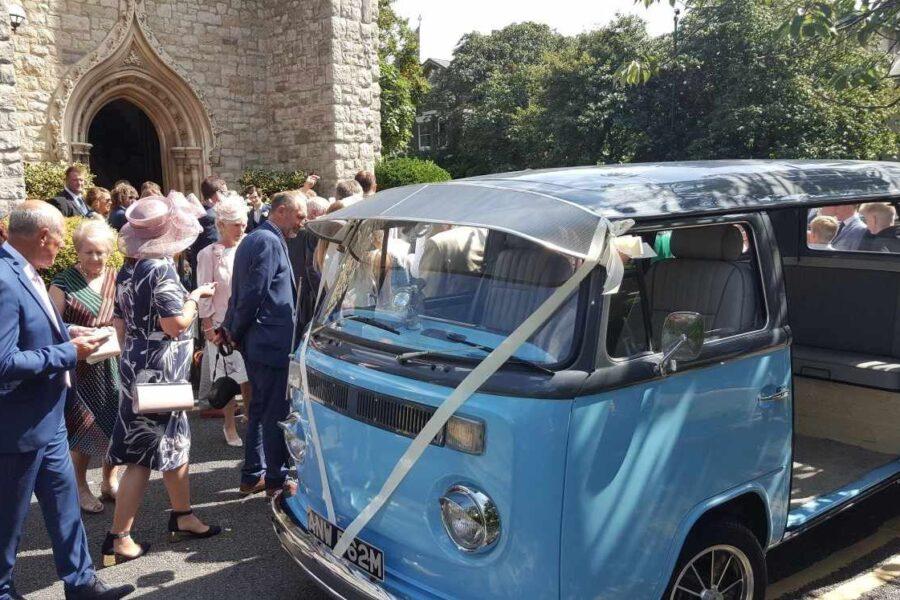 Aussie outside a church after wedding guests come outside